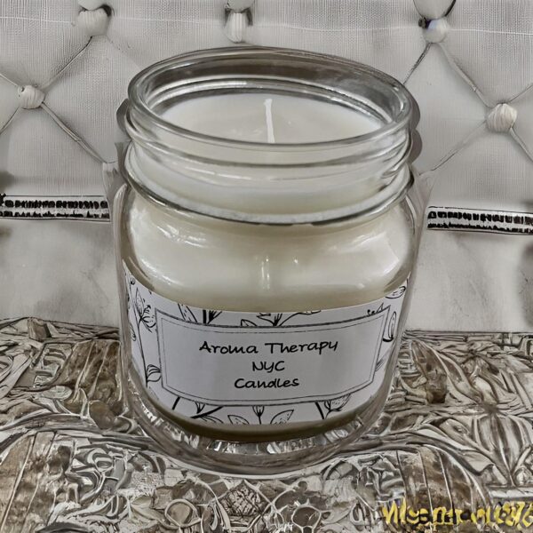 Scented candle in a glass jar on the display of the website