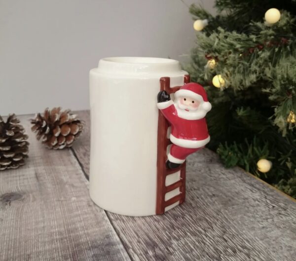 A Santa Wax Warmer With a Santa Figure